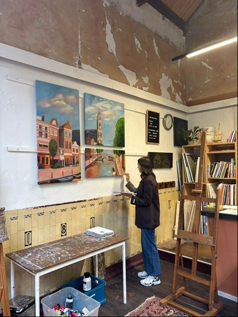 TaraBoute painting in the studio